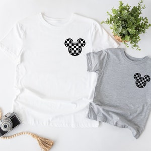 a couple of shirts sitting on top of a table