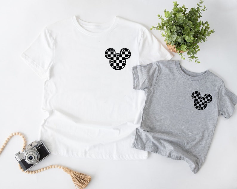 a couple of shirts sitting on top of a table