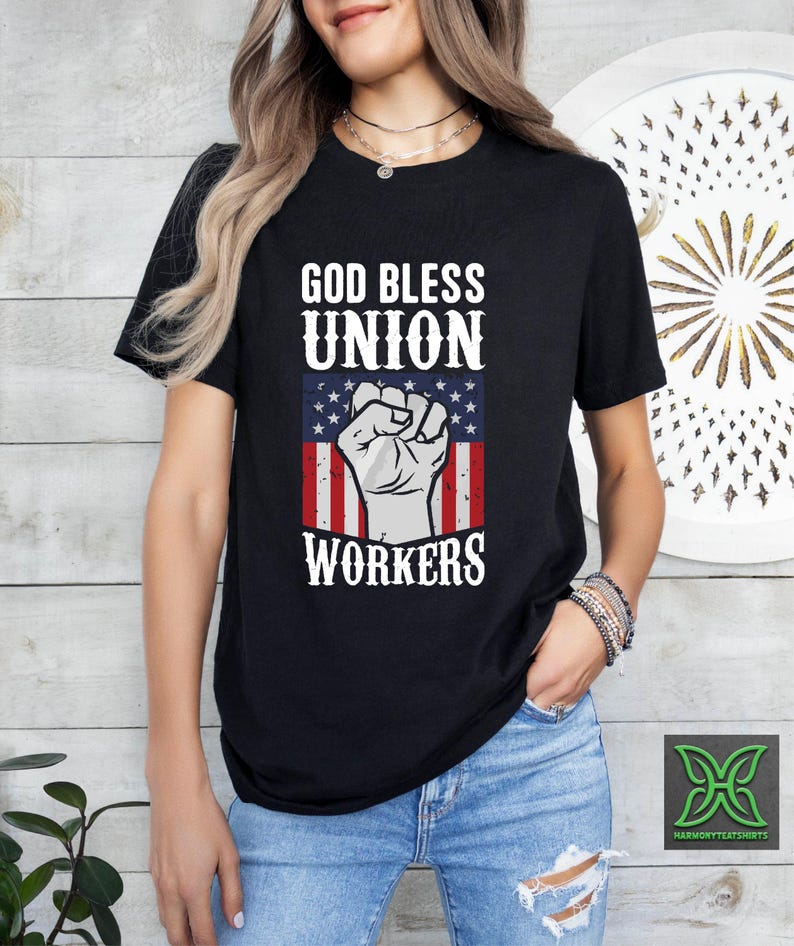 a woman wearing a black shirt that says god bless union workers