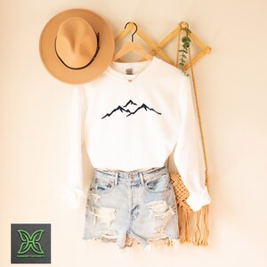 a pair of shorts, a hat, and a t - shirt hanging on a