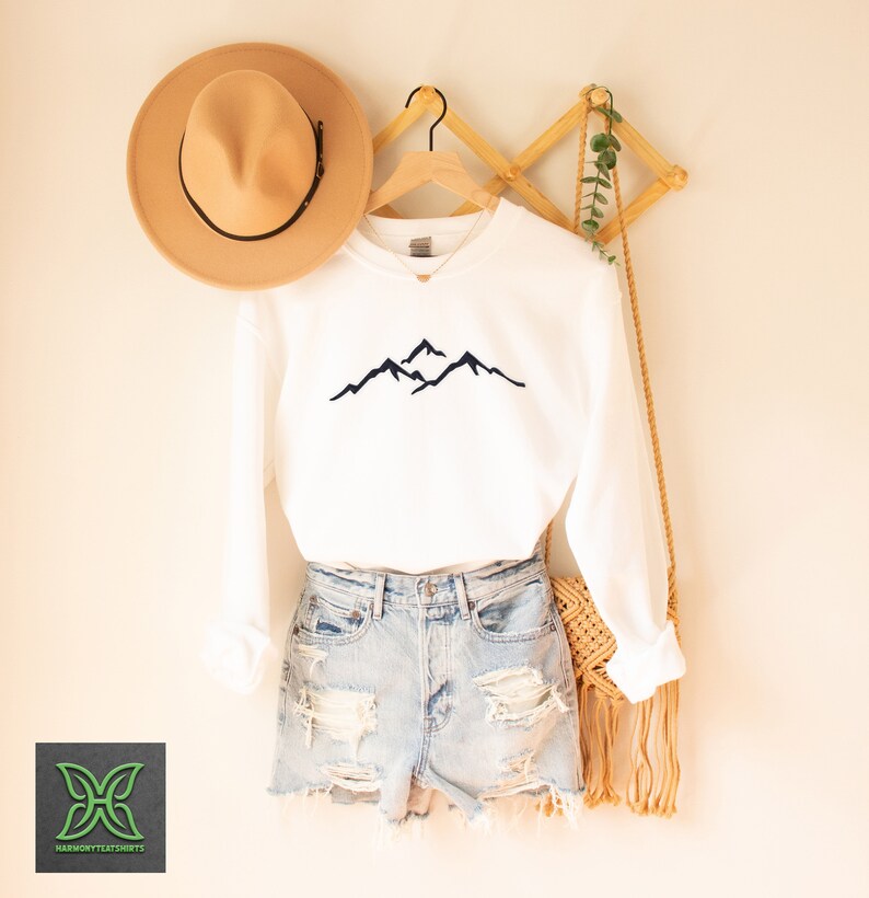 a pair of shorts, a hat, and a t - shirt hanging on a