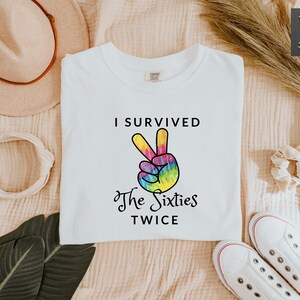 a t - shirt that says i survived the sixties twice