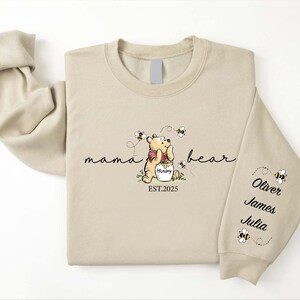 Custom Mama Bear Est 2025 Sweatshirt with Kids Name on Sleeve, Winnie the Pooh Mothers Days Gift, Personalized New Mom, Nana,Grandma Sweater