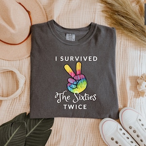 a t - shirt that says i survived the sixties twice
