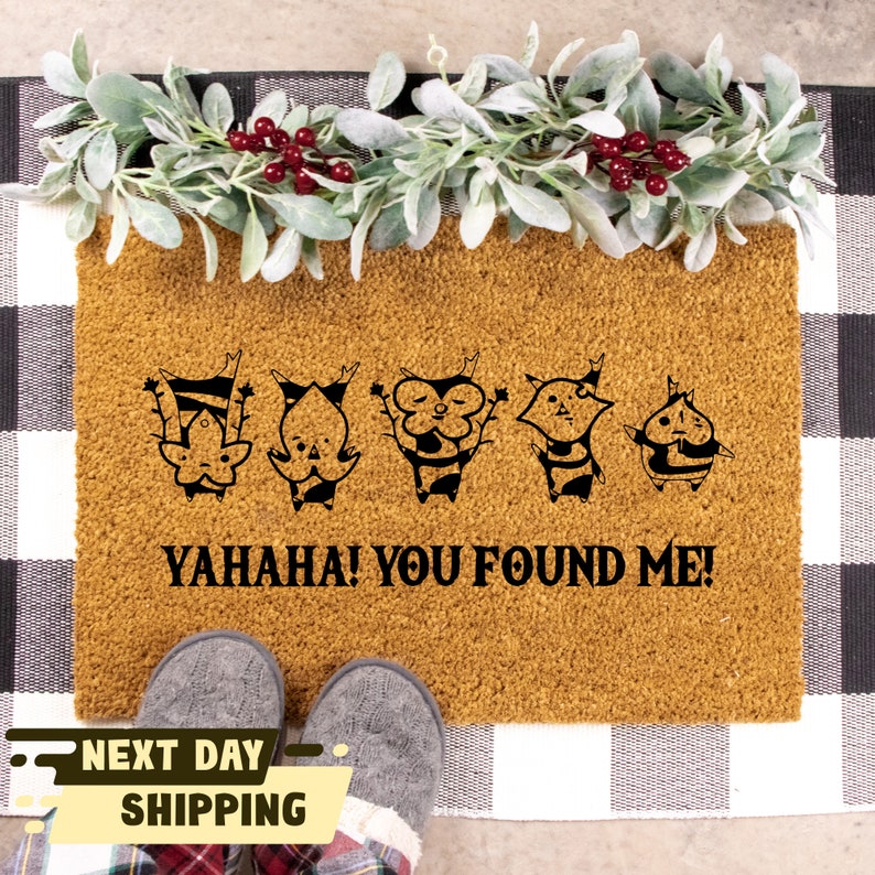 May include: A brown doormat with five black cartoon characters and the text "YAHAHA! YOU FOUND ME!"