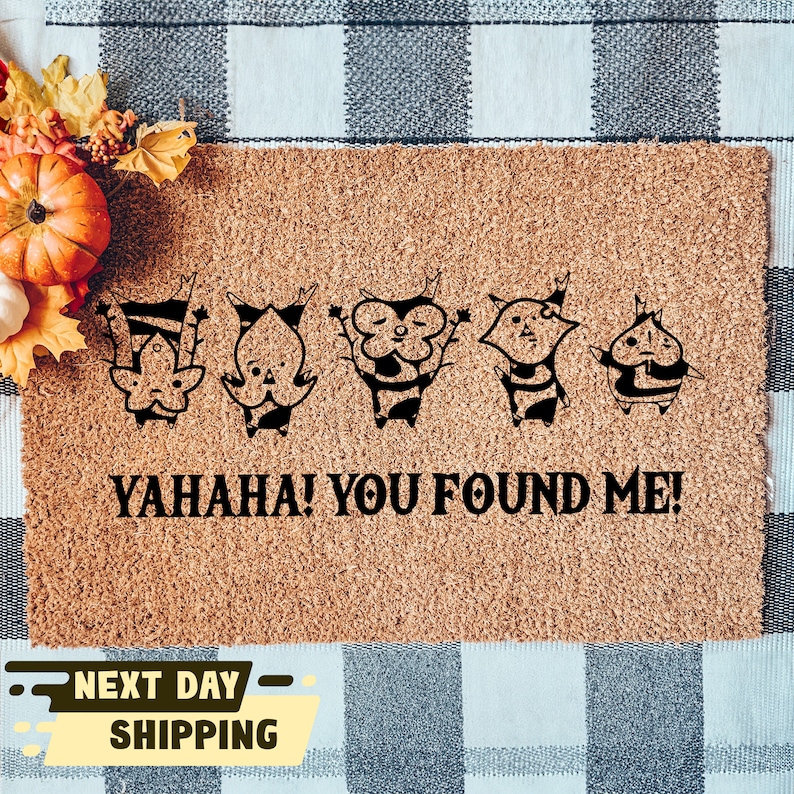 May include: A brown coir doormat with five black cartoon characters and the text "YAHAHA! YOU FOUND ME!"