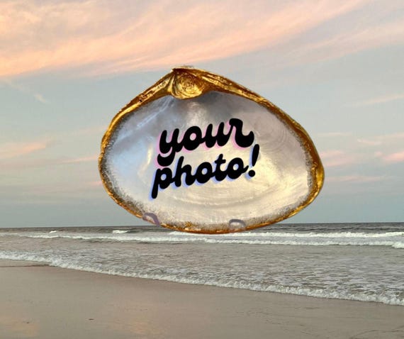 Happy moments captured on a shell. Your personal photo transferred into a shell, sealed with resin and displayed with a stand.