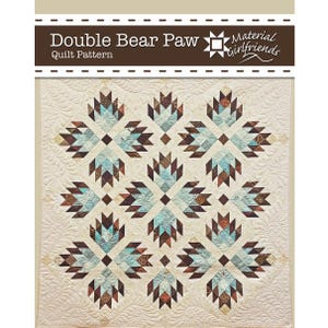 May include: A Double Bear Paw quilt pattern by Material Girlfriends featuring a cream-colored background with repeating geometric bear paw motifs in shades of light blue, dark brown, and tan, accented by intricate swirling quilted textures.