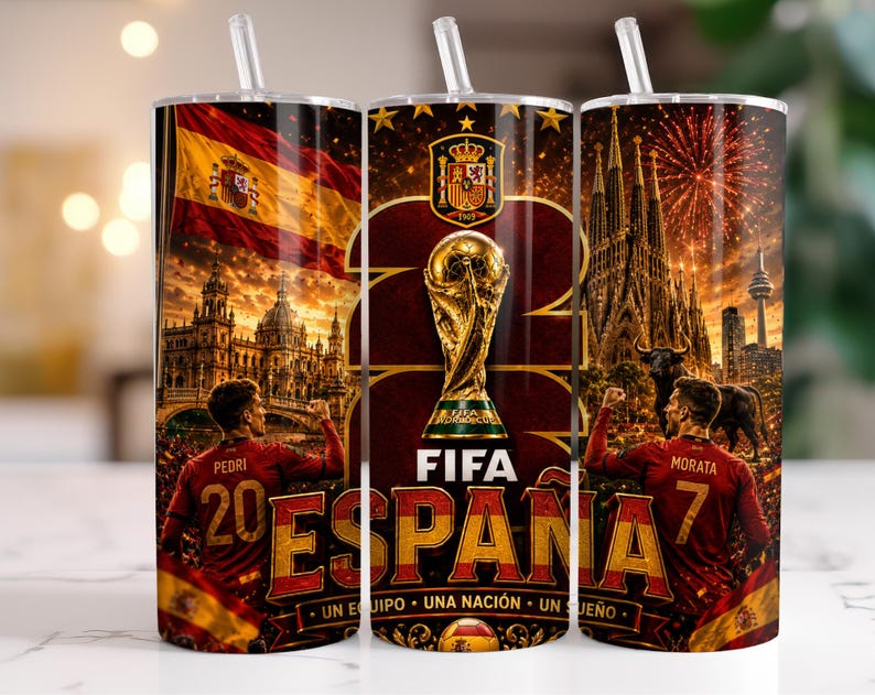 May include: A cylindrical tumbler with a straw featuring a graphic design of the Spanish national football team. It displays the FIFA World Cup trophy, the Spanish flag, football players Pedri and Morata, the Sagrada Familia, and the text FIFA ESPA&Ntilde;A.