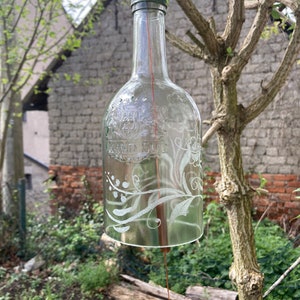 Hand-engraved wine bottle wind chime for outdoors with flower motif