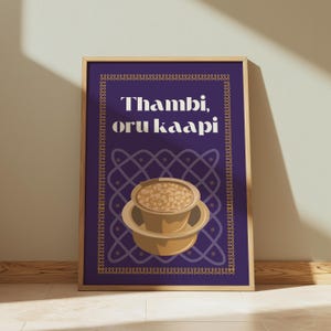May include: A purple poster with a gold frame featuring a cup of coffee with the text "Thambi, oru kaapi" in a gold font.