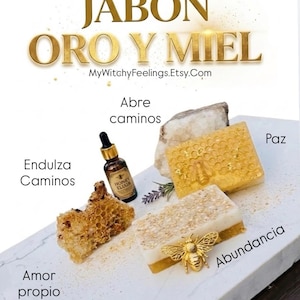 May include: An image featuring soaps and related items. The text "JABÓN ORO Y MIEL" is displayed at the top. Other text includes "MyWitchyFeelings.Etsy.Com", "Honey Elixir", and Spanish words like "Abundancia" and "Amor Propio".