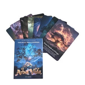 May include: A deck of rectangular oracle cards featuring vibrant nature-themed illustrations. The box displays the text 'Oráculo de Alma y Sabiduría' and 'El Árbol de la Vida', while one card shows a tree under a fiery sky with the text 'Estoy Forjada en el Fuego'.