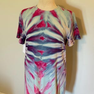 Ice tie dyed cotton dress in raspberry pink, purple and light blue. Above the knee length. Sizes adult medium and large available.