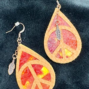 Unique tie dye earrings made from tie dyed coffee filters and transformed into one of a kind pieces of jewelry.