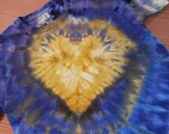 Blue and gold ice tie dyed. Youth size medium with a heart design in the tie dye.