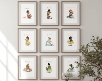 May include: Nine framed art prints with watercolor illustrations of children in various outfits. Each print has a gold frame and features a child with a positive affirmation such as "Be Brave" or "Be Kind". The prints are displayed on a white wall.