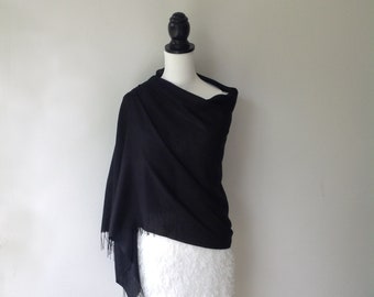 Elegant black pashmina / scarf.  Lightweight with tassels, suitable for all occasions.  Vibrant colour and soft on skin.