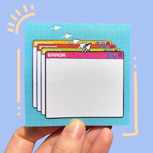 May include: A square sticky note with a light blue grid background featuring a stack of four computer error windows in yellow, red, green, and pink. Each window displays the text ERROR at the top, with white mouse cursor icons layered above.