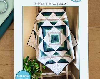 May include: A quilt pattern booklet titled PERCUSSION by Lisa Lund for Shadow Valley Quilts. The cover features a geometric quilt in shades of dark green, light green, and white, with text indicating sizes for baby, lap, throw, and queen.