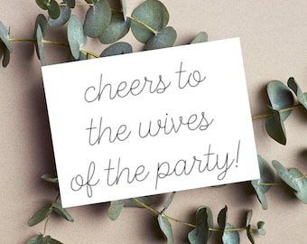 cheers to the wives of the party! wedding card