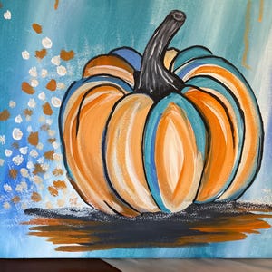 May include: A square canvas painting featuring a central pumpkin with orange and teal segments and a dark gray stem. The background is a light blue gradient with scattered white and gold paint dabs on the left and a dark shadow below.
