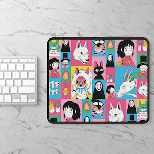 May include: A rectangular mousepad featuring a colorful grid pattern with various anime character illustrations. The design includes characters from a popular animated film, set against vibrant pink, yellow, blue, and green backgrounds. The mousepad has a black border.