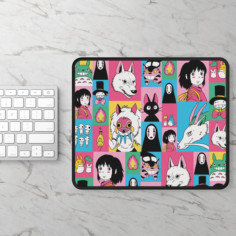 May include: A rectangular mousepad featuring a colorful grid pattern with various anime character illustrations. The design includes characters from a popular animated film, set against vibrant pink, yellow, blue, and green backgrounds. The mousepad has a black border.