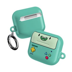 May include: Two teal-colored AirPod cases. One case is open, revealing the white interior. The other case is closed and features a cartoon face design with a yellow plus sign and blue triangle. A silver carabiner clip is attached.