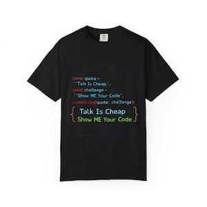 May include: Black t-shirt with the text "Talk Is Cheap Show ME Your Code" in a colorful, code-like font. The shirt also features lines of code above the text, making it a great gift for programmers and coders.