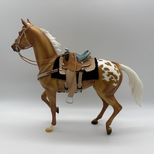 Hand crafted leather Western  saddle and bridle and horse “Lydia”