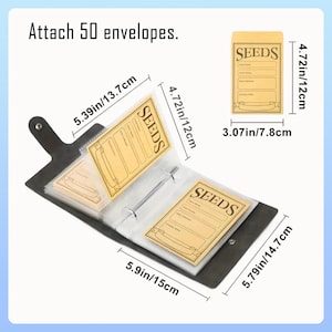 May include: A black seed organiser with a ring binder, holding several seed packets. The packets are tan with the word "SEEDS" and measurement labels in cm and inches. The text "Attach 50 envelopes" is at the top.