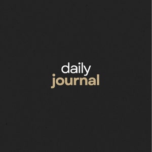 May include: A black journal with the words "daily journal" in white and gold lettering. The text "QUANTUM JOURNEY" is at the top, and "DAILY PROMPTS TO GUIDE YOU IN EXPANSION AND ABUNDANCE" is at the bottom.