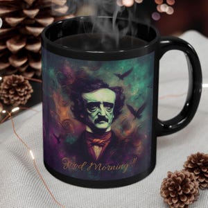 May include: Black coffee mug featuring a colourful illustration of Edgar Allan Poe and the text "Good Morning!!"