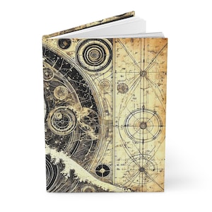 May include: A vintage-style journal with a cover featuring a detailed illustration of a celestial map with circles, lines, and numbers. The background is a faded yellow with a black and white design.