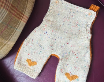 Hand-knitted heart dungarees