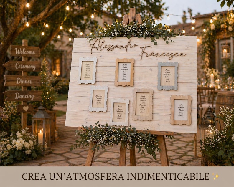 May include: A wooden wedding seating chart with the names "Alessandro Francesca" in cursive. Six framed cards display guest names. The sign is decorated with greenery and set on a wooden easel. The background includes a wooden signpost and string lights.