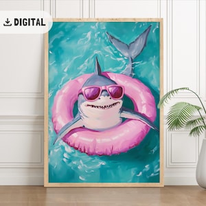 May include: Digital print of a shark wearing pink sunglasses and a pink inflatable ring, floating in turquoise water. The shark has a toothy grin and a gray body. The print is in a wooden frame and has the word "DIGITAL" in the upper left corner.