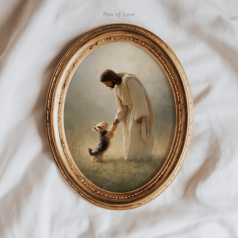 May include: An oval framed print with a religious theme. The image shows a figure in white robes interacting with a small dog. The frame is gold-coloured with an elaborate pattern. The text "Paw of Love" is visible at the top of the image.