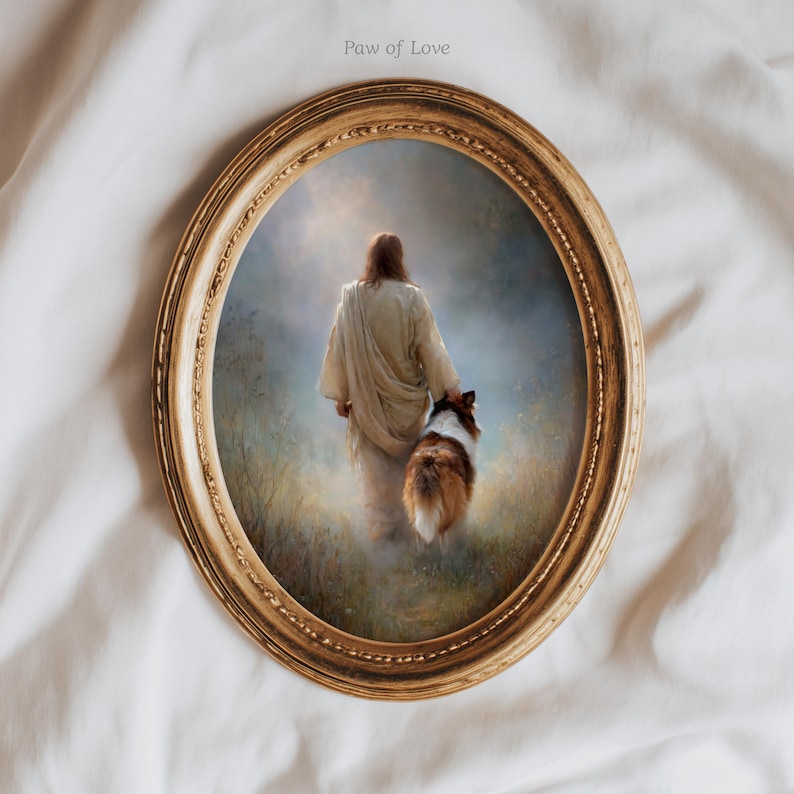 May include: An oval framed print featuring a person in a white robe walking with a dog. The dog has brown and white fur. The frame is gold with a detailed edge. The text "Paw of Love" is in the upper left corner.