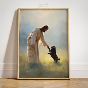 May include: Framed art print titled "Paw of Love" depicts a figure in flowing robes extending a hand to a black pug dog. The dog stands on its hind legs, reaching up. The background features a soft, ethereal landscape with a warm, golden light.
