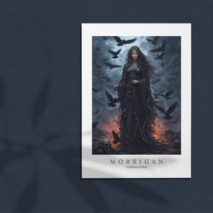 May include: A digital art print of a woman in a black dress standing in a field of crows. The woman has long dark hair and is holding a staff. The text "MORRIGAN Goddess of War" is at the bottom of the print.