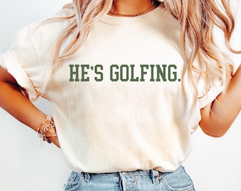 Comfort Colors® Golf Wife Shirt, He&#39;s Golfing Shirt, Golfing Wife, Girls Golfing Shirt Husband Golf, Funny Golf Shirt, Women&#39;s Golf Shirt