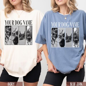 May include: Two t-shirts with a photo collage of dogs on the front. The text "YOUR DOG NAME" is printed above the photos. The t-shirt on the left is ivory and the t-shirt on the right is blue jean.