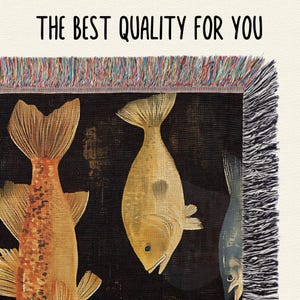 May include: A tapestry featuring a black background with two gold fish. The fish are stylized and have a textured appearance. The tapestry has a fringe border.