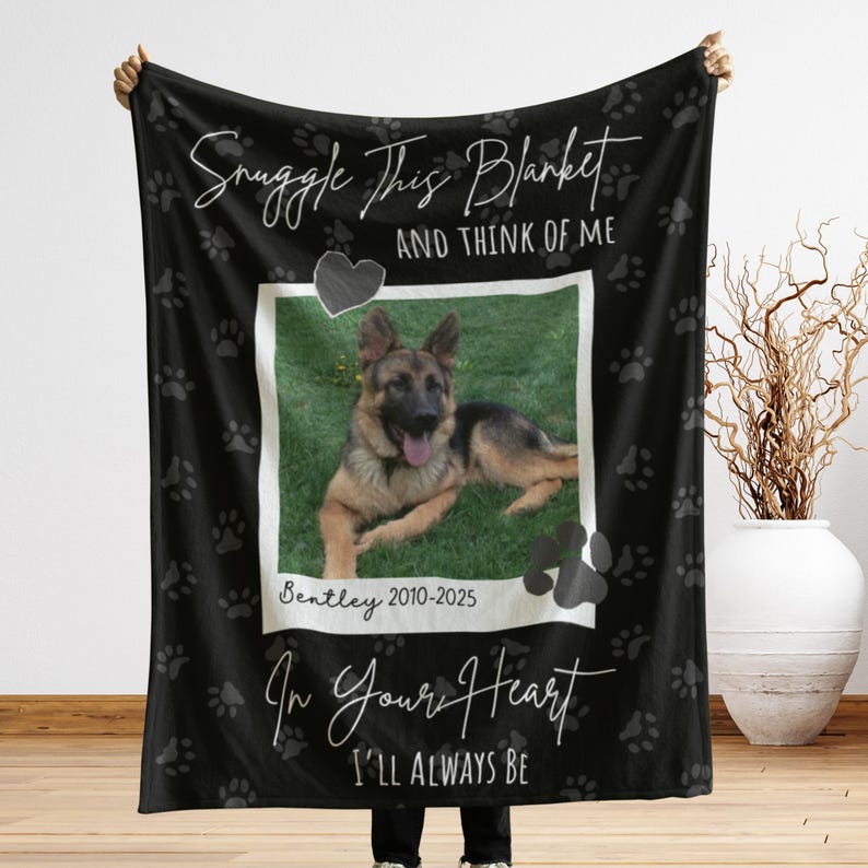May include: Black blanket with a photo of a German Shepherd dog, paw prints, and text. The text reads "Snuggle This Blanket And Think Of Me" and "In Your Heart I'll Always Be". The dog's name and years are also printed on the blanket.