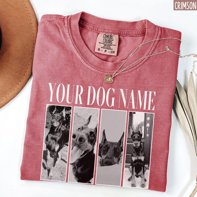 May include: Crimson red t-shirt with a white graphic of four dogs. The graphic says "Your Dog Name" above the images of the dogs.