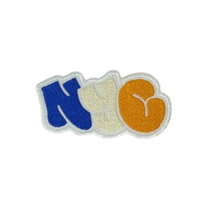 May include: Embroidered patch with the letters "NYC" in a bubble font. The "N" is blue, the "Y" is cream, and the "C" is orange. Each letter has a white border and is on a white background.