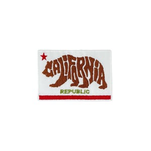 May include: A white patch with a red star in the top left corner. The patch features a brown bear silhouette made up of the word "CALIFORNIA" and the text "REPUBLIC" in green below the bear.
