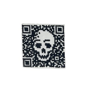 May include: A white fabric patch with a black embroidered skull inside a QR code.